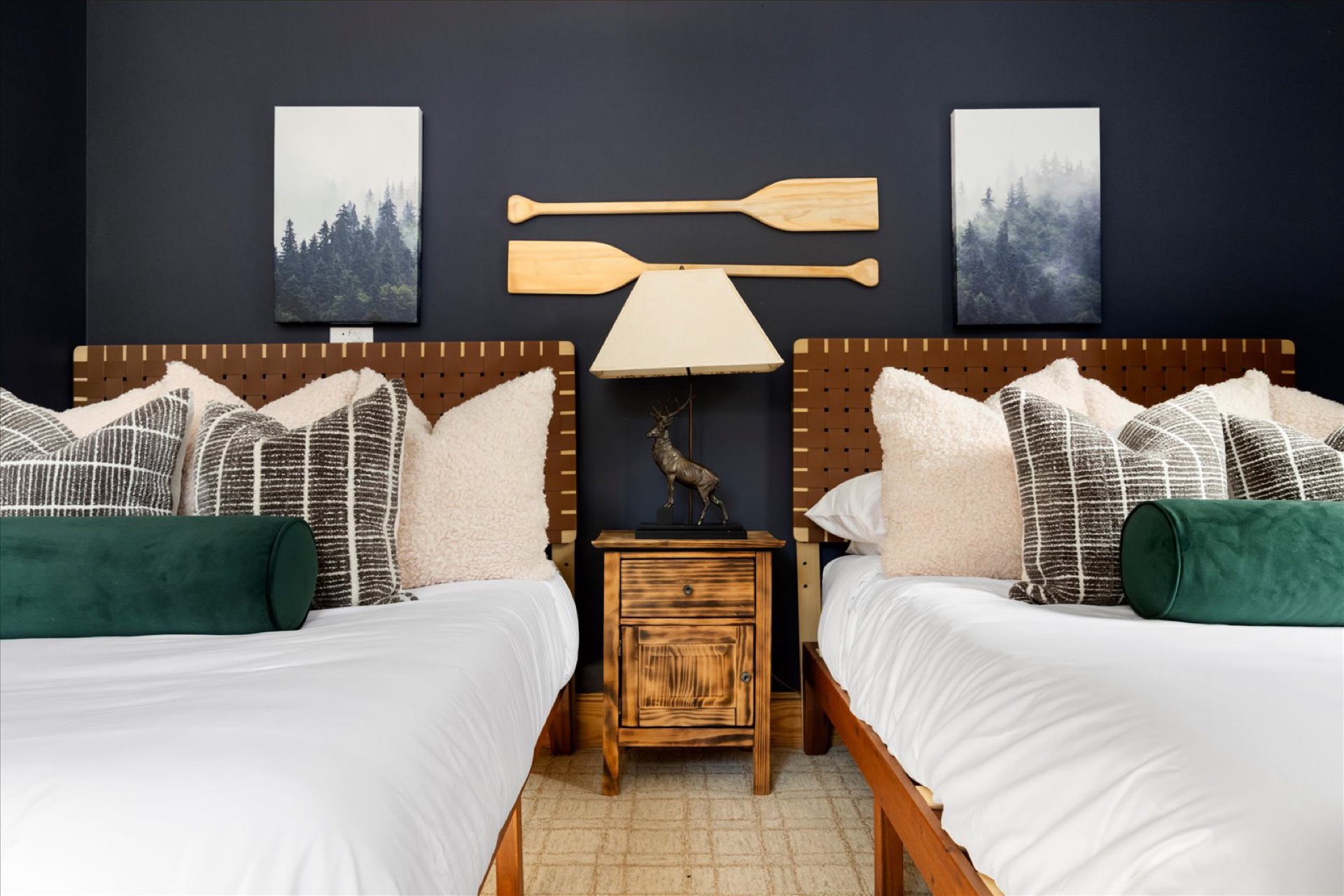 Upper Level Bedroom with two full beds and paddle decor